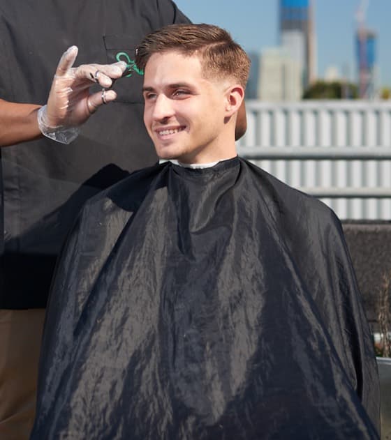 Mobile barber giving haircut at home in San Francisco
